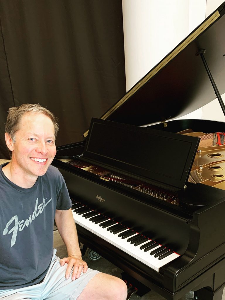 Quentin tuning Baldwin grand piano