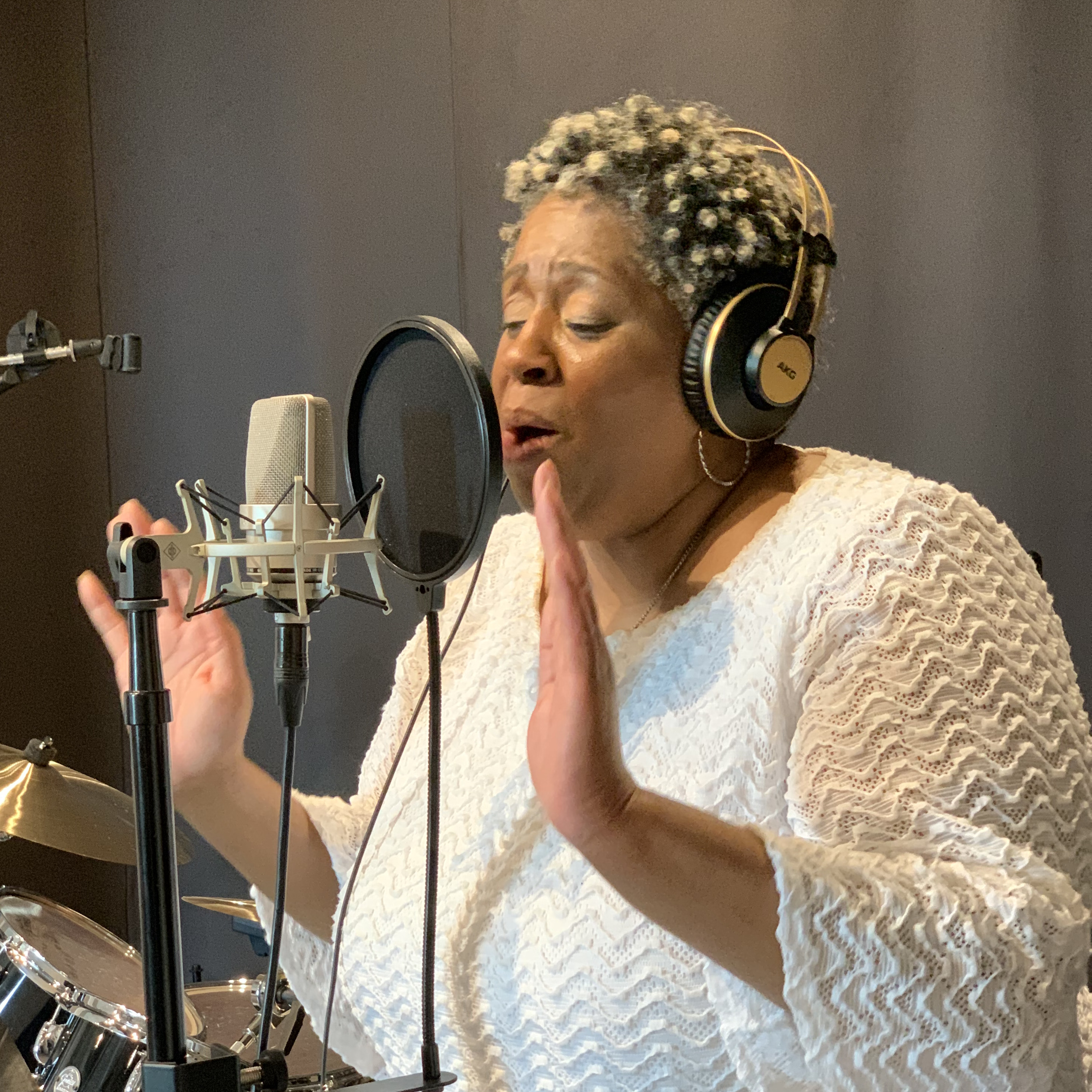 Gospel vocalist singing overdubs for her new single release.