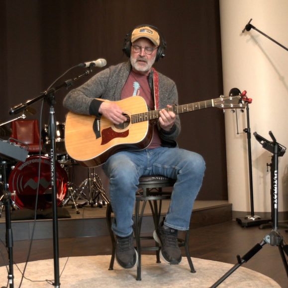 Scott Stilwell records original songs with vocals and acoustic guitar for his Celtic Midwestern album